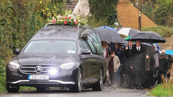 Mourners outside the Church of the Assumption as the coffin of Denise Morgan arrives ahead of her funeral