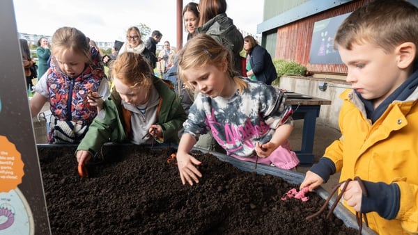Some children dig into the soil at Airfield Estate!