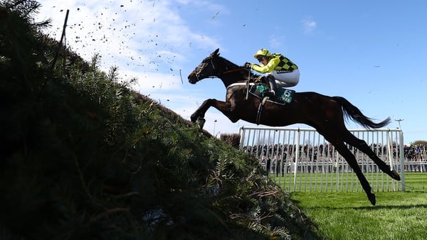 Shishkin and Nico de Boinville jump the last fence en route to winning the Aintree Bowl Chase during the Grand National Festival